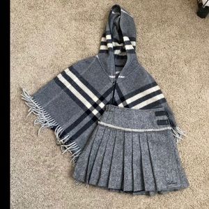 Burberry girl poncho and skirt.